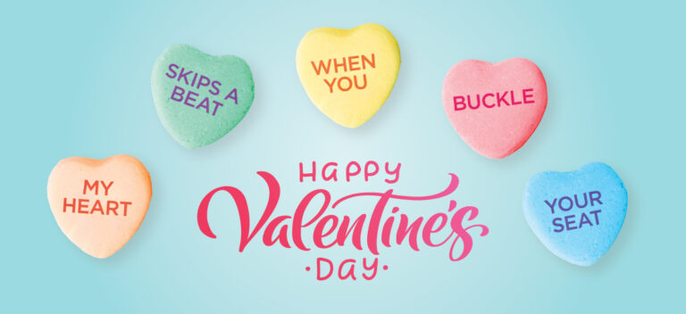 Happy Valentine's Day message with pastel candy hearts on a blue background. Hearts read: "My Heart," "Skips a Beat," "When You," "Buckle," "Your Seat."